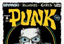 Cover der ersten Ausgabe des PUNK Magazins von Januar 1976, gestaltet von John Holmstrom. Illustration zeigt Lou Reed in Comicstil mit übergroßer Brille und Lederjacke.